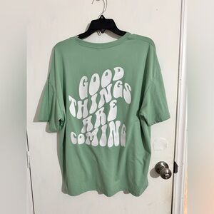 Big t-shirt and a work out shirt, never worn